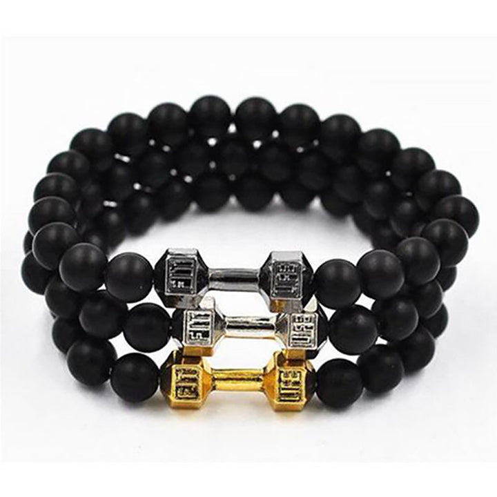 "Svart unisex hantelarmband i onyx och lavasten för chakra, elegant design, naturliga stenar, accessoar för energi och stil."