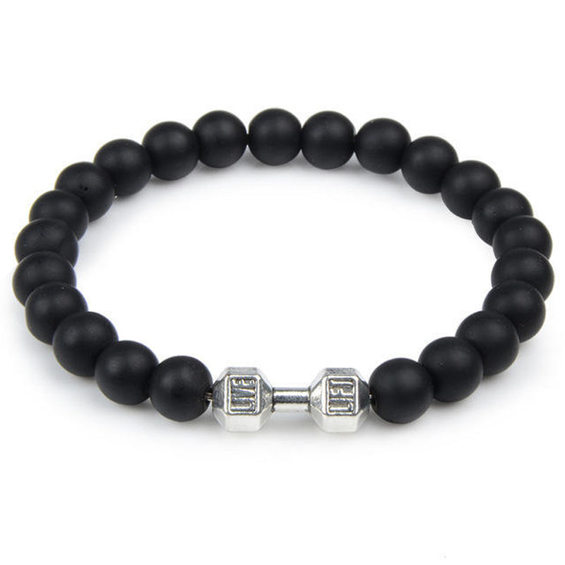 "Svart unisex hantelarmband i onyx och lavasten för chakra, elegant design, naturliga stenar, accessoar för energi och stil."