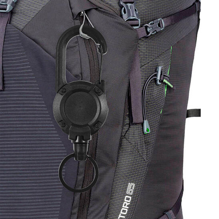 "Svart/vit multifunktionell nyckelring med infällbar vajer, hållbar aluminiumkarbin för utomhusbruk, ca 12,5 cm lång."