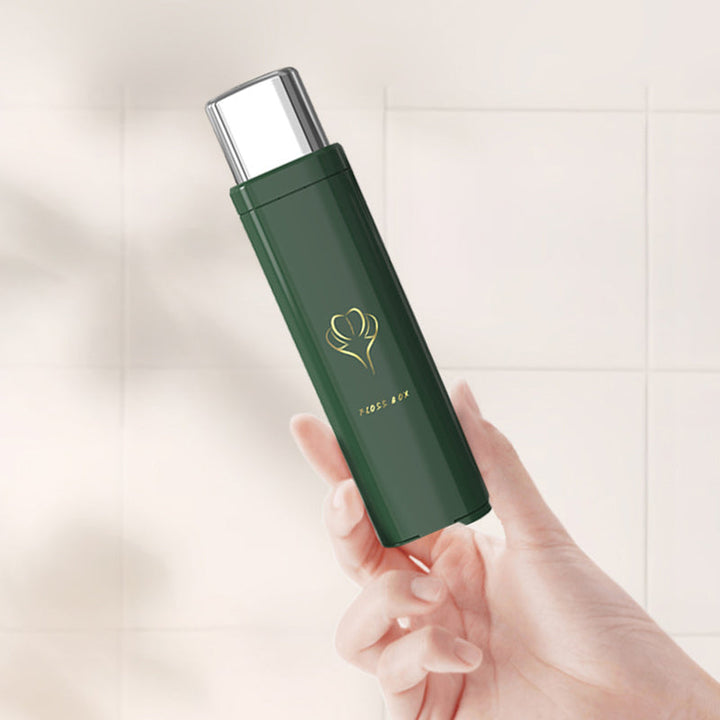 "Tandtrådsdispenser för resor i grön, rosa, vit. Bärbar och kompakt accessoar för enkel användning och påfyllning."