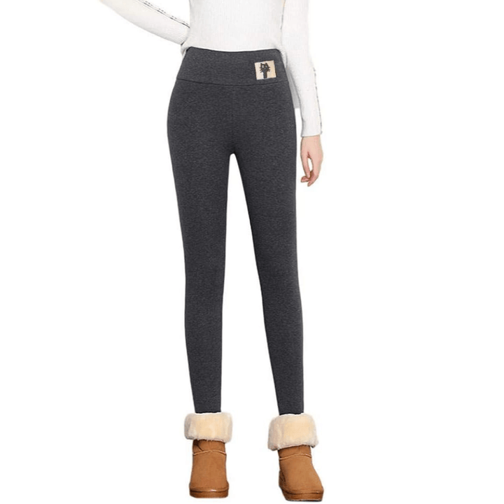 "Tjocka fleecefodrade leggings för kvinnor, svart färg, hög midja, mjuk fleece insida idealisk för vinterkomfort."