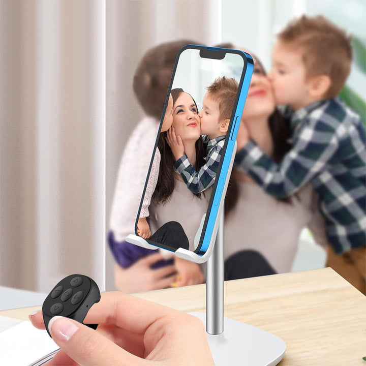 "Trådlös Bluetooth-ringfjärrkontroll för mobil, ergonomisk design, kompakt storlek, finns i svart, rosa, vit."