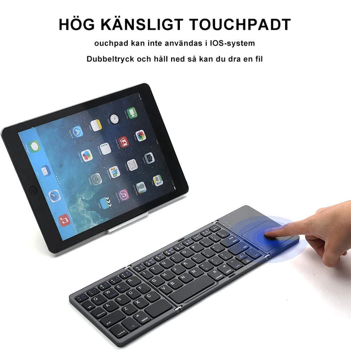 "Trådlöst Bluetooth-hopfällbart tangentbord med svart pekplatta, kompakt design, perfekt för portabelt skrivande."