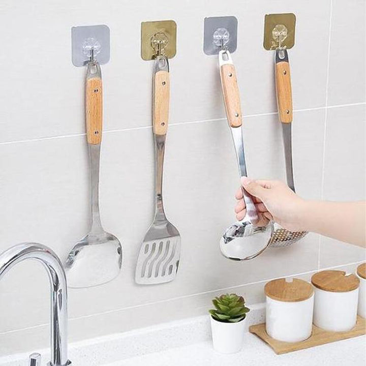 "Transparent självhäftande krok i rostfritt stål och PVC, hög lastkapacitet, diskret design, passar varje inredning."