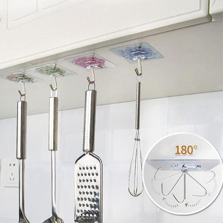"Transparent självhäftande krok i rostfritt stål och PVC, hög lastkapacitet, diskret design, passar varje inredning."