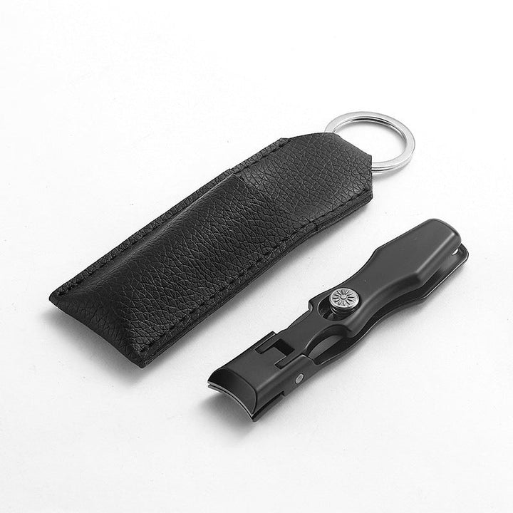 "Ultraskarp nagelklippare i rostfritt stål med modern design, effektiv för tjocka naglar, svart och silverfärg, 9x1.6 cm."