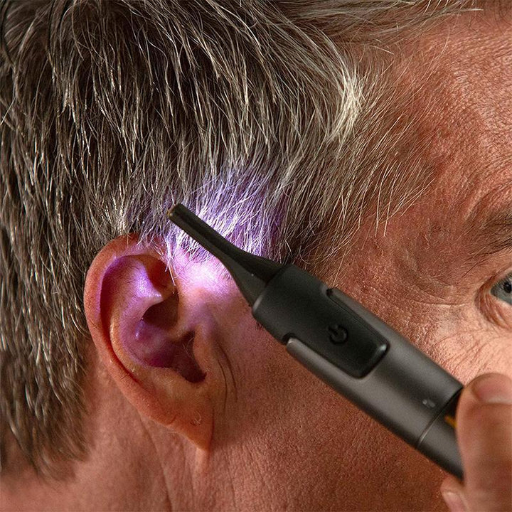 "Ultratunn precisionstrimmer med rostfria stålblad och grått grepp, optimerad för personlig hälsovård, sladdlös och portabel.