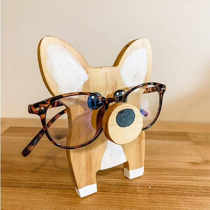 "Unikt trä glasögonställ med djurdesign som corgi och katt, perfekt för hemmet. Dekorativ och funktionell inredningsdetalj."