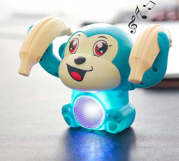 Förpackning av den rullande apan, framhäver dess funktioner som utvecklingsleksak med ljus/ljud.