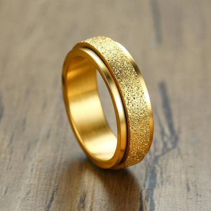 "Unisex sandblästrad roterande fidget ring i rostfritt stål, elegant och modern design, flera färger tillgängliga."