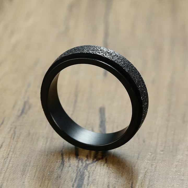 "Unisex sandblästrad roterande fidget ring i rostfritt stål, elegant och modern design, flera färger tillgängliga."