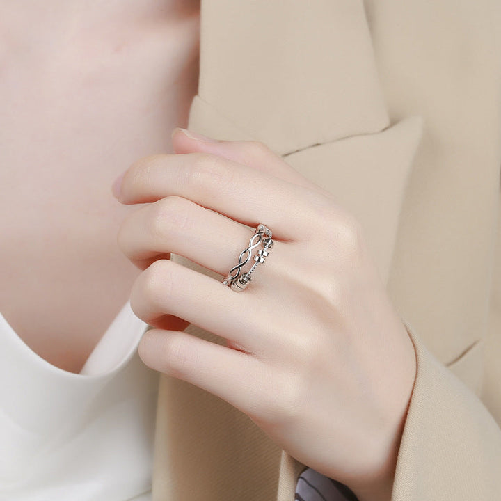 "Unisex silver infinity fidget ring med justerbar design, kedjelänkmönster, perfekt för stresslindring och stil."