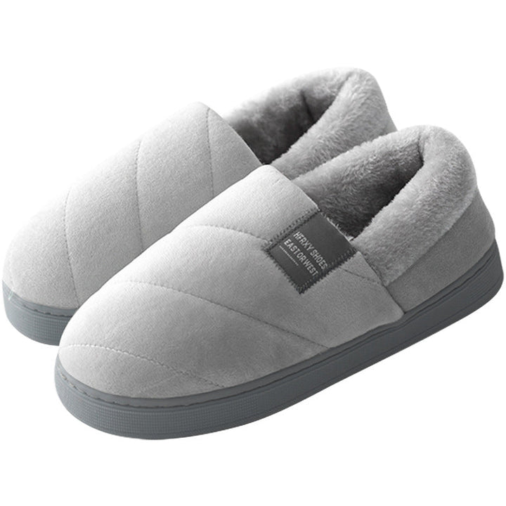 Unisex tofflor, pälsstil, i enfärgad design, erbjuder värme och halkskydd för kalla dagar