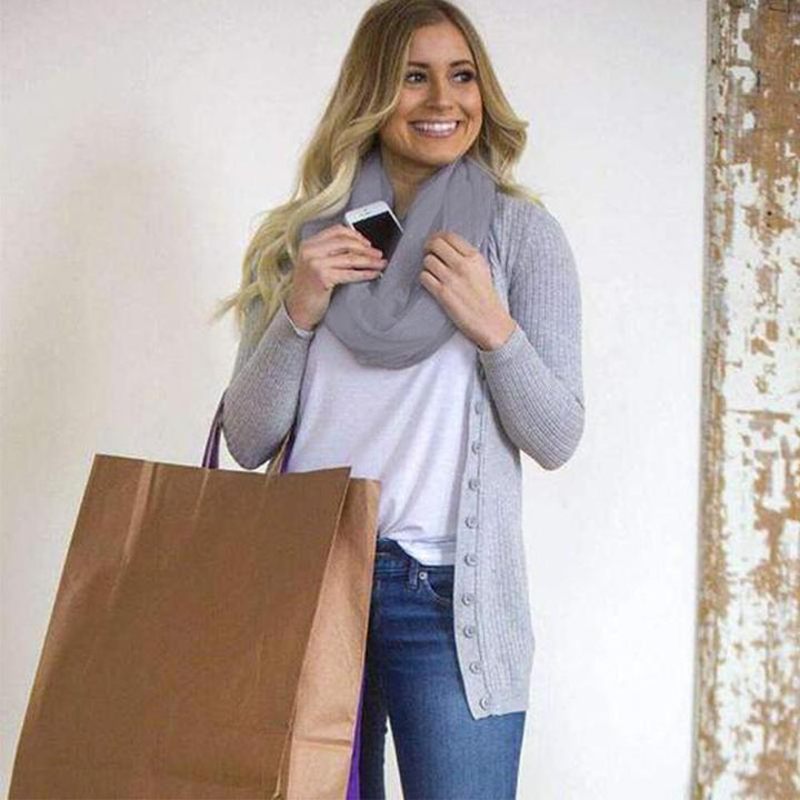 "Unisex vinterljuddämpare med dold ficka, mjukt material, elegant design, flera färger. Perfekt för kyliga dagar."