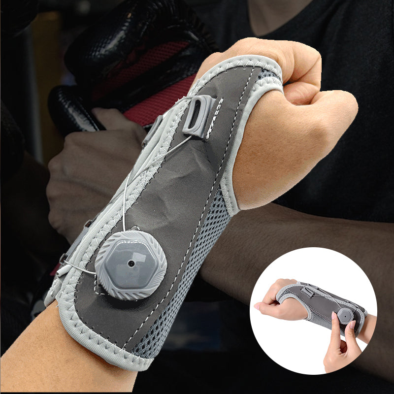 "Unisex vrist stödbandage i grå och svart för sport och träning, med justerbar passform och mikrofibertyg för stöd."