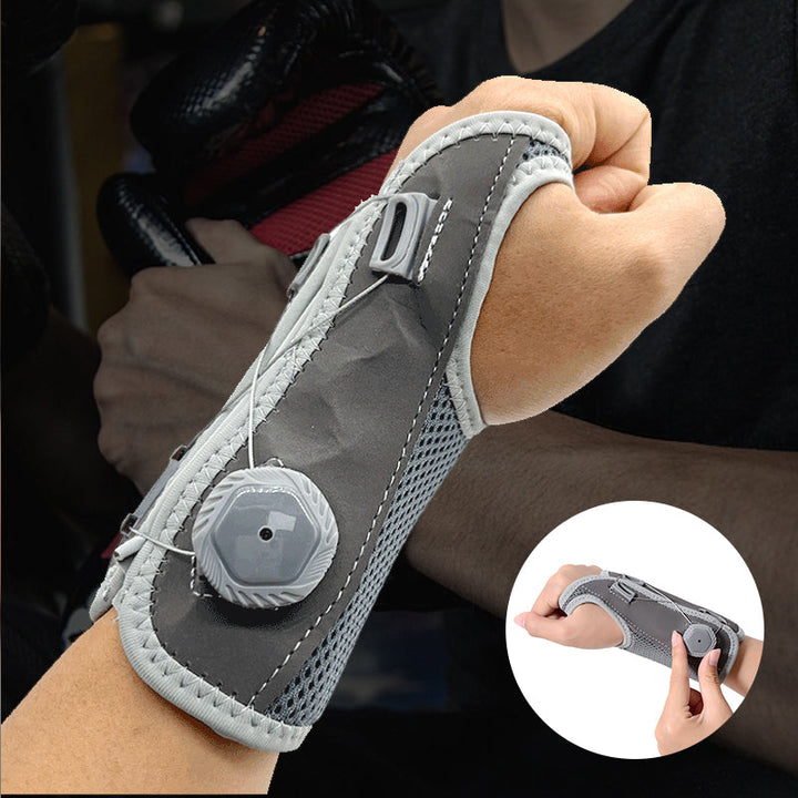 "Unisex vrist stödbandage i grå och svart för sport och träning, med justerbar passform och mikrofibertyg för stöd."