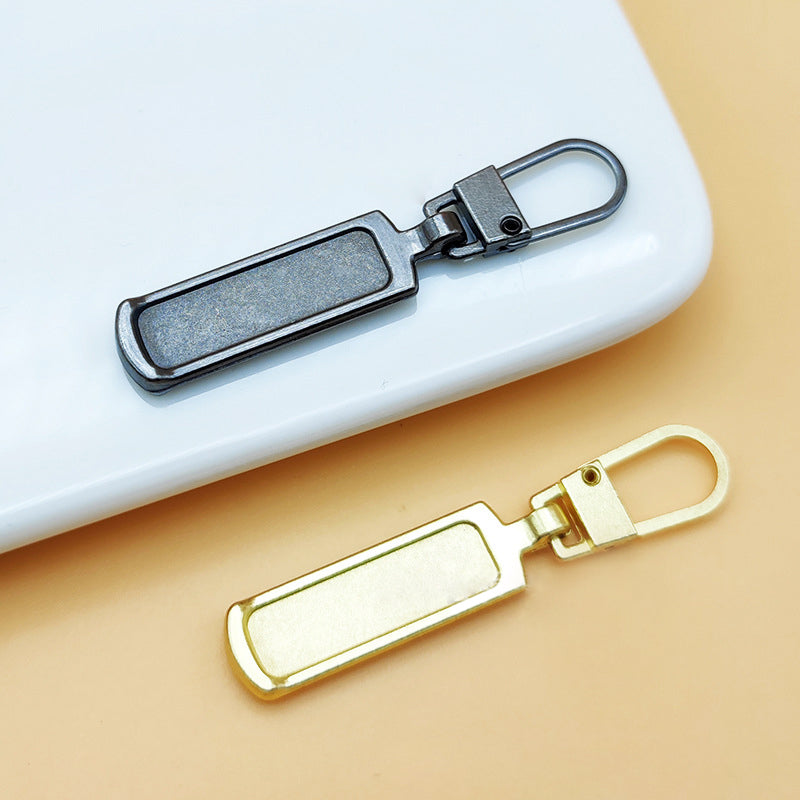 "Universalt avtagbart metallhandtag för dragkedjor, silver, perfekt för kläder och väskor, rektangulärt, robust design."