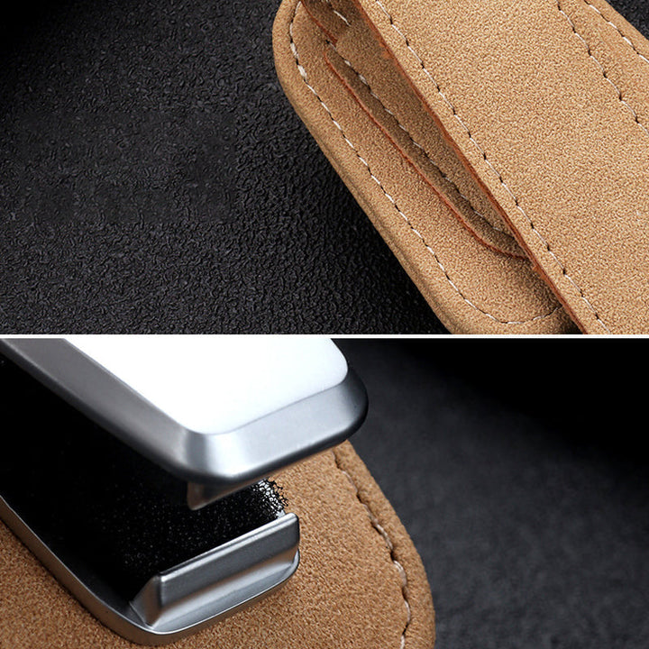 "Universell solglasögonklämma på bilvisir, robust aluminium och läder, skyddar glasögon, kompakt och lätt att installera."