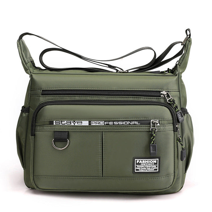 "Vattentät axelväska i slitstark nylon, crossbody design för utomhus och vardag, unisex."