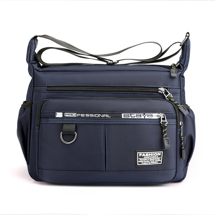 "Vattentät axelväska i slitstark nylon, crossbody design för utomhus och vardag, unisex."