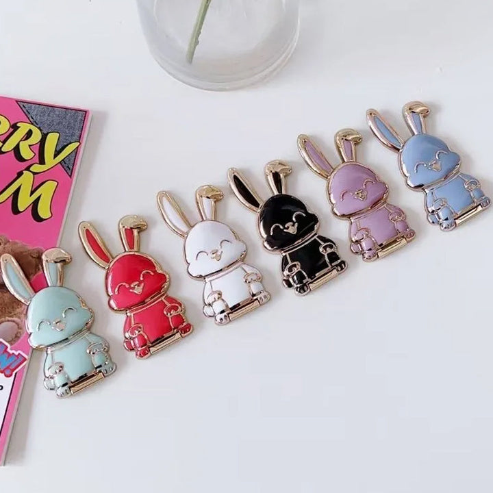 "Vikbar kanintelefonhållare i ljusblått, framifrån med starkt 3M-fäste och unikt bedårande design, perfekt för handsfree"