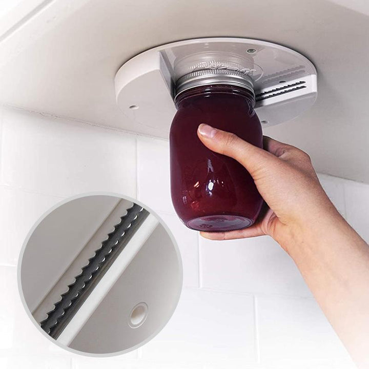 "Vit burköppnare av metall/ABS som öppnar burkar och flaskor av alla storlekar, diskret design för köksinstallation."