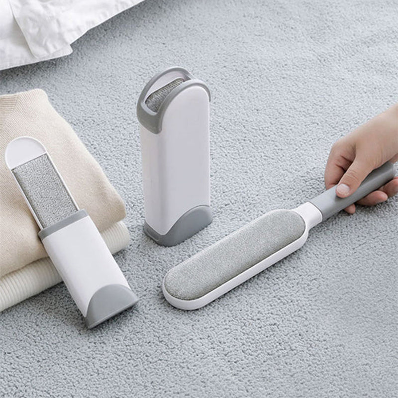 "Vit unisex hår- och luddborttagning borste med ergonomisk design, perfekt för kläder och möbler, tillverkad i plast."