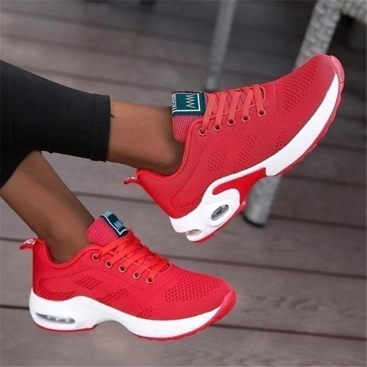 "Vita dam-sneakers med air cushion-sula och andningsbar mesh-överdel för stil och komfort."