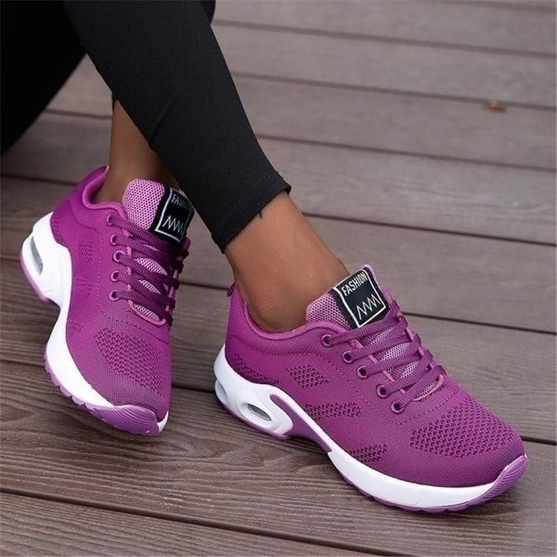 "Vita dam-sneakers med air cushion-sula och andningsbar mesh-överdel för stil och komfort."