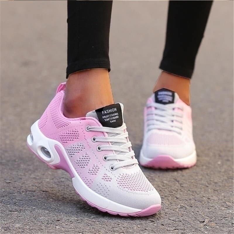 "Vita dam-sneakers med air cushion-sula och andningsbar mesh-överdel för stil och komfort."