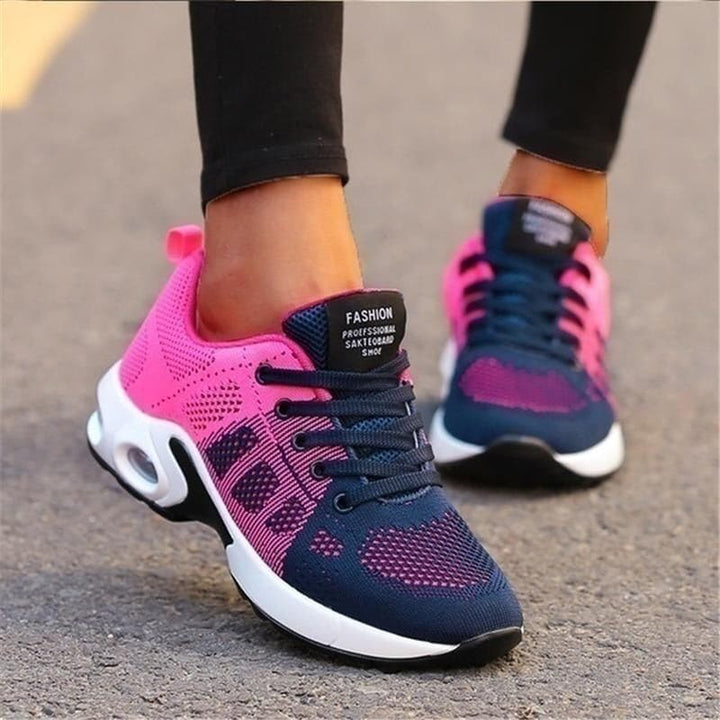 "Vita dam-sneakers med air cushion-sula och andningsbar mesh-överdel för stil och komfort."