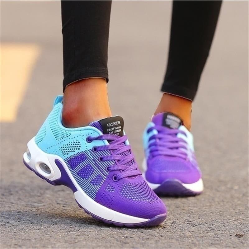 "Vita dam-sneakers med air cushion-sula och andningsbar mesh-överdel för stil och komfort."