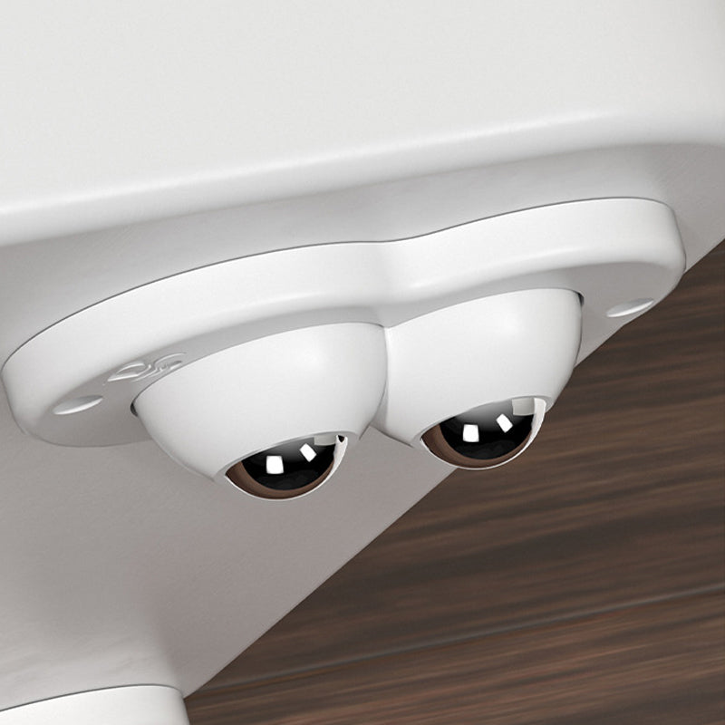 "Vita och svarta självhäftande mini 360° gummihjul; idealiska för enkel förflyttning av möbler och lådor i hemmet."